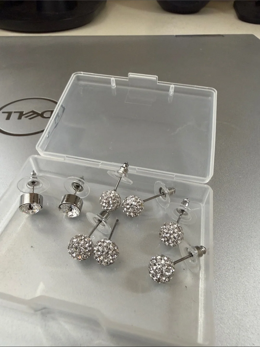 4 pairs sparkle studs. Never worn. So cute and sparkly.